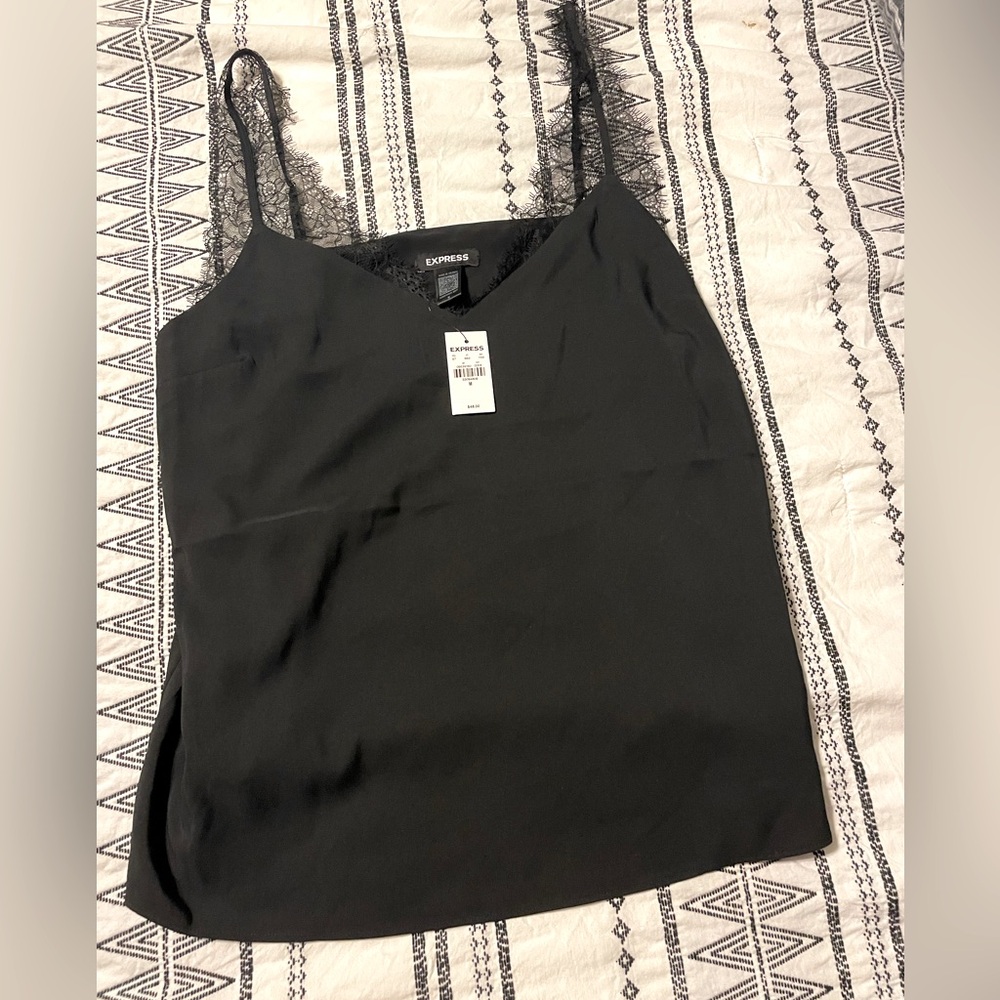 New with tags! Express camisole with wispy lace shoulder details.